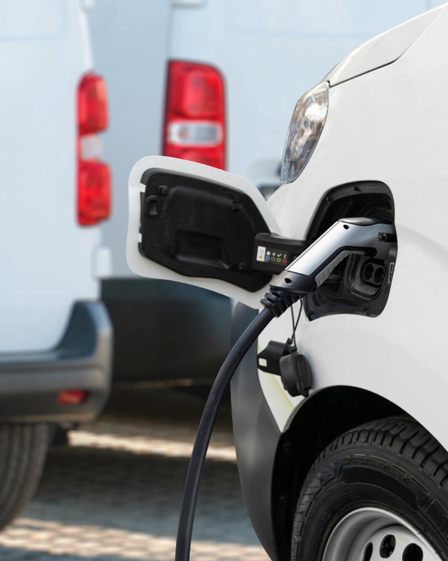 picture of charging lead going into electric van as CLOUD NINE use carbon-neutral delivery 